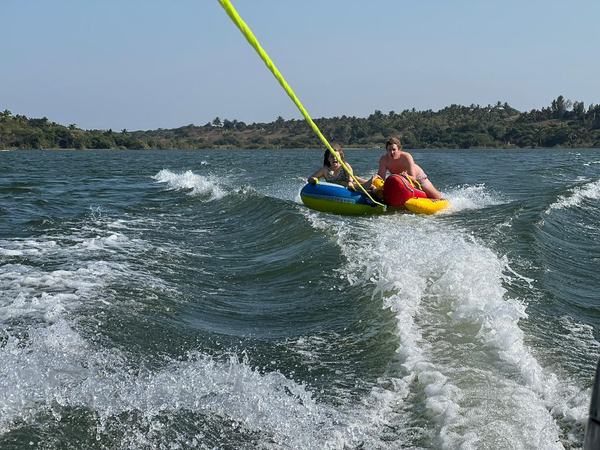 Tube riding water sports fun for families at Chidenguele beach resort
